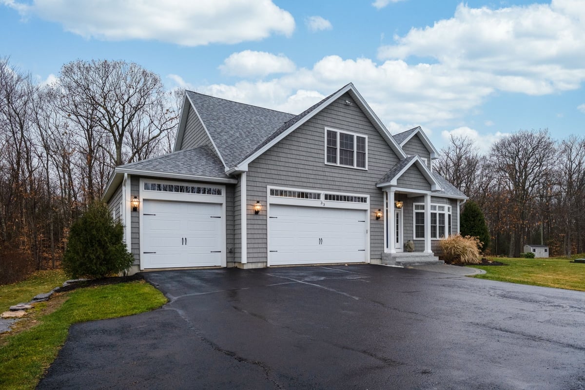 Modern home with asphalt driveway
