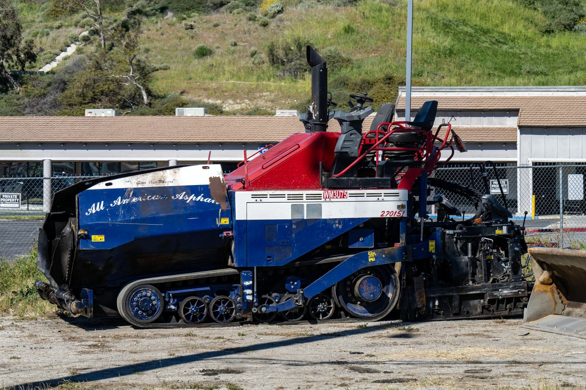 Paving equipment at commercial site